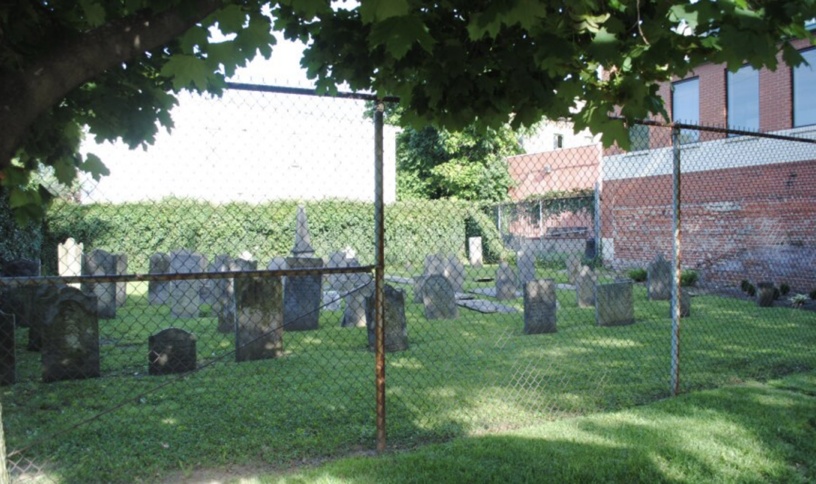 The former chain-link fence surrounding Chestnut Street Cemetery