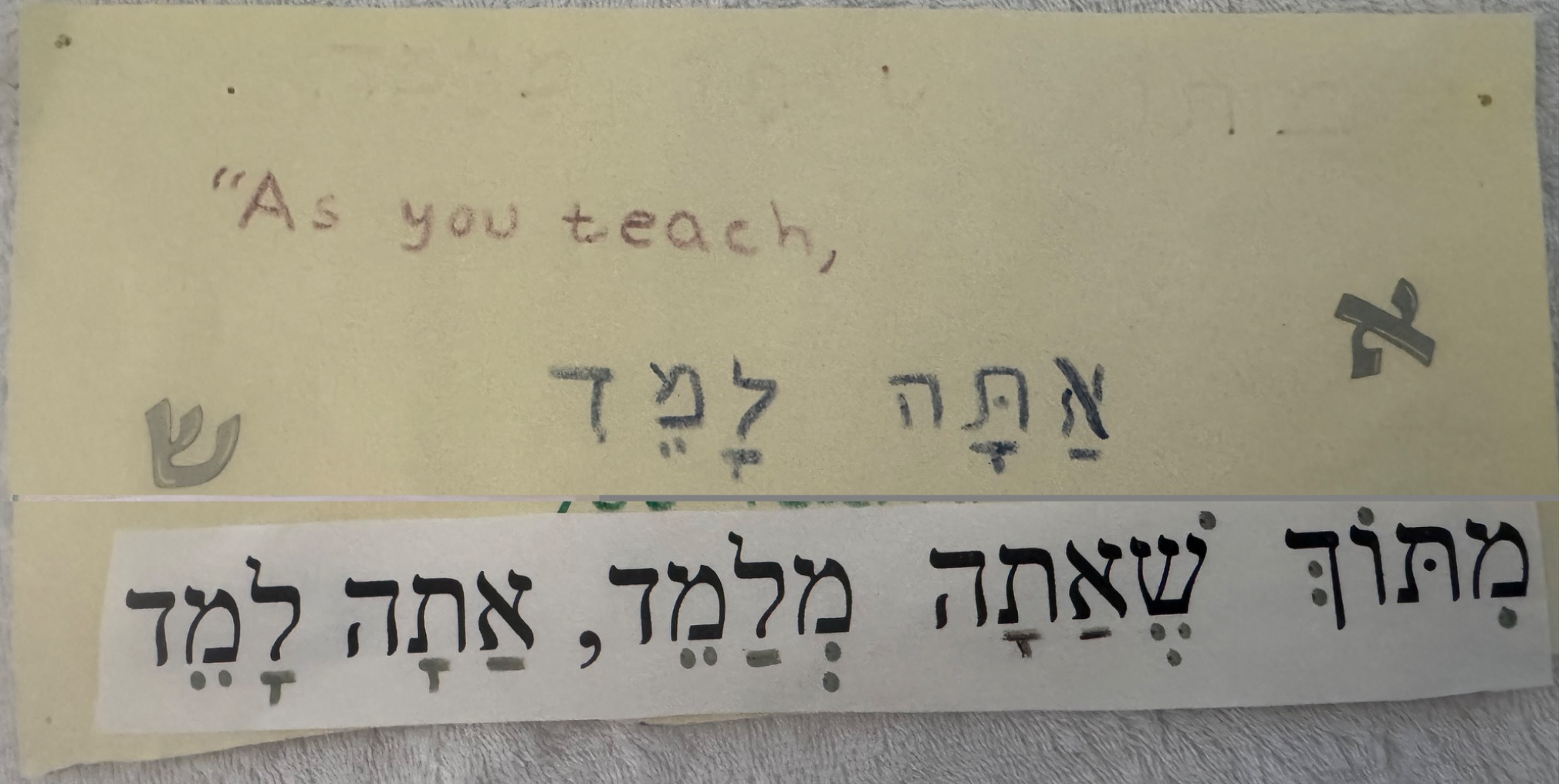 Classroom sign reading As you teach, you learn